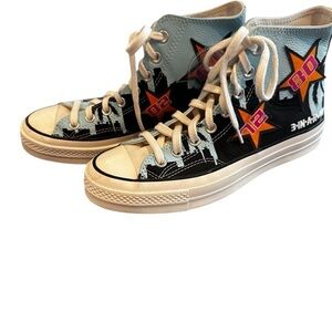 Converse Chuck Taylor High-Tops with White and Black Accents.